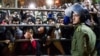 FILE - Iranians react during a public execution in Tehran, Iran, Jan. 20, 2013. 