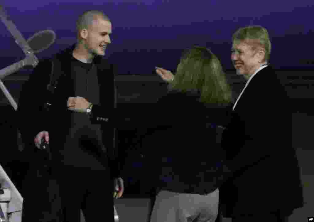 Matthew Miller, who had been held in North Korea since April 2014, is greeted after arriving at Joint Base Lewis-McChord, Washington, Nov. 8, 2014.