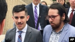 FILE - ACLU lawyer Chase Strangio, left, and plaintiff Joaquin Carcano address reporters after a hearing, June 25, 2018, in Winston-Salem, N.C., 