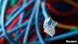FILE - An internet cable is seen in a server room.