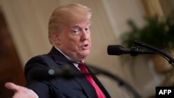 FILE - U.S. President Donald Trump speaks during a press conference at the White House in Washington, Jan. 10, 2018.