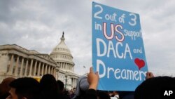 Une manifestation devant le Congrès pour défendre le programme duDeferred Action for Childhood Arrivals (DACA), le 5 décembre 2017, à Capitol Hill à Washington.