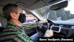 Vožnja pod zaštitinim merama u Podgorici (Foto: Rojters)