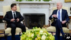 President Joe Biden, right, meets with Ukrainian President Volodymyr Zelenskiy in the Oval Office of the White House, in Washington, Sept. 1, 2021. 