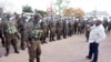 In this photo supplied by the Mozambican Presidency, President Filipe Nyusi, right, during a visit to his Defence and Security Force Troops in Northern Mozambique, July 9, 2021.
