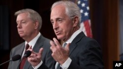 Senate Foreign Relations Committee Chairman Sen. Bob Corker, R-Tenn., joined at left by Sen. Lindsey Graham, R-S.C., speaks with reporters after his panel approved the "Taylor Force Act," which suspends U.S. financial aid to the Palestinian Authority, at the Capitol in Washington, Aug. 3, 2017.