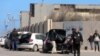 Passengers are seen after being evacuated at Mitiga airport in Tripoli, Libya, April 8, 2019. 