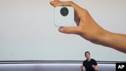 Google's Juston Payne talks about the Google Clips camera at a Google event at the SFJAZZ Center in San Francisco, Wednesday, Oct. 4, 2017. (AP Photo/Jeff Chiu)