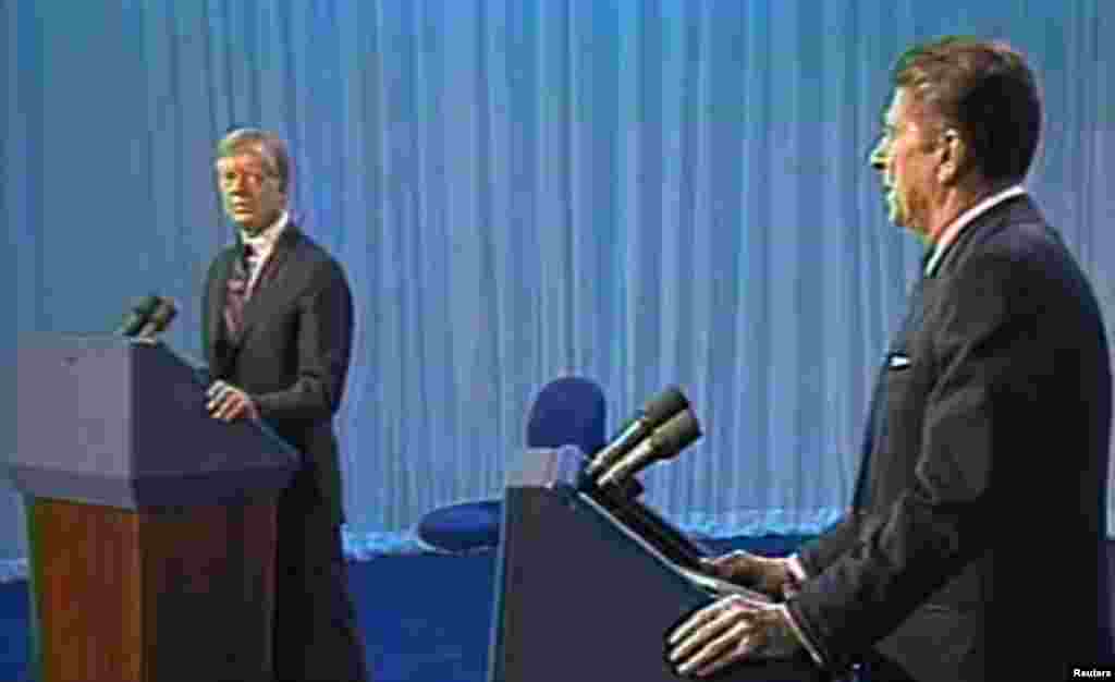 U.S. President Jimmy Carter and California Governor Ronald Reagan during a U.S. presidential election debate in Cleveland, Ohio, Oct. 28, 1980.