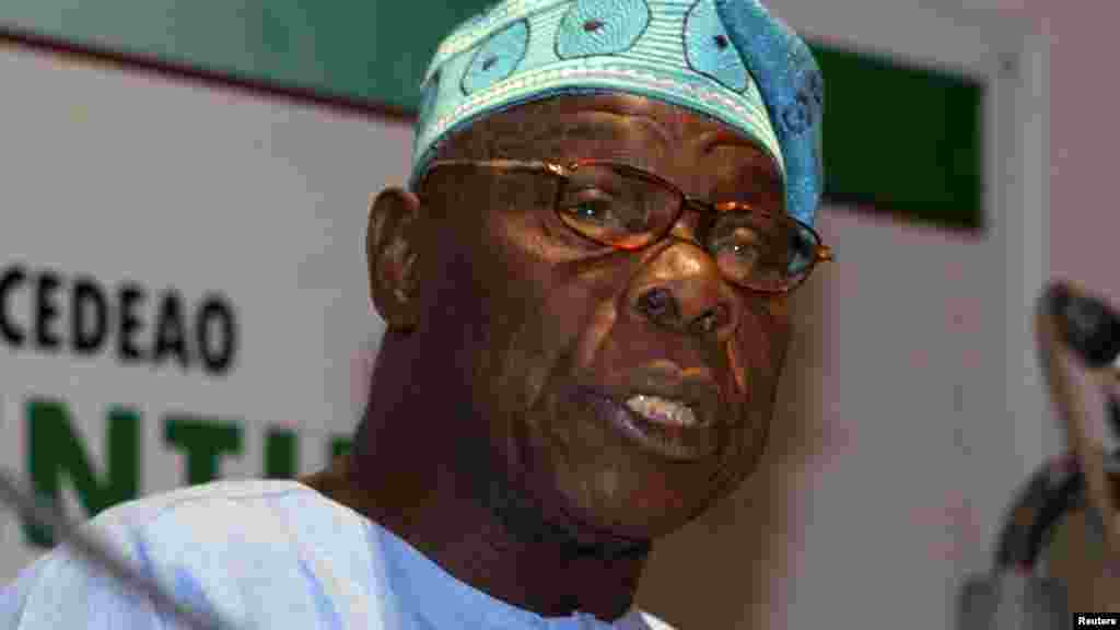 Former Nigerian President Olusegun Obasanjo, an envoy of the African Union and West Africa's ECOWAS bloc, speaks to journalists at a news conference in the capital Dakar February 25, 2012.