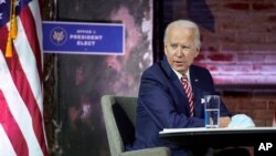 President-elect Joe Biden attends a briefing on the economy at The Queen theater, Monday, Nov. 16, 2020, in Wilmington, Del. (AP Photo/Andrew Harnik)