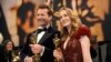 Trent, left, and Victoria Warmerdam, winners of the award for best live action short film for "I'm Not a Robot," attend the Governors Ball after the Oscars on March 2, 2025, in Los Angeles.