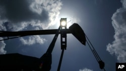 Oil is pumped from a well near Van, Texas. The U.S. made its first export of crude oil from Texas last Thursday.(AP) 